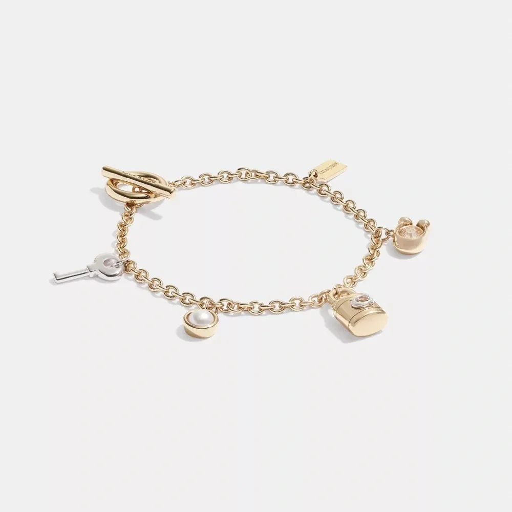 Elegant Gold and Silver Charm Bracelet - Picture 2 of 8